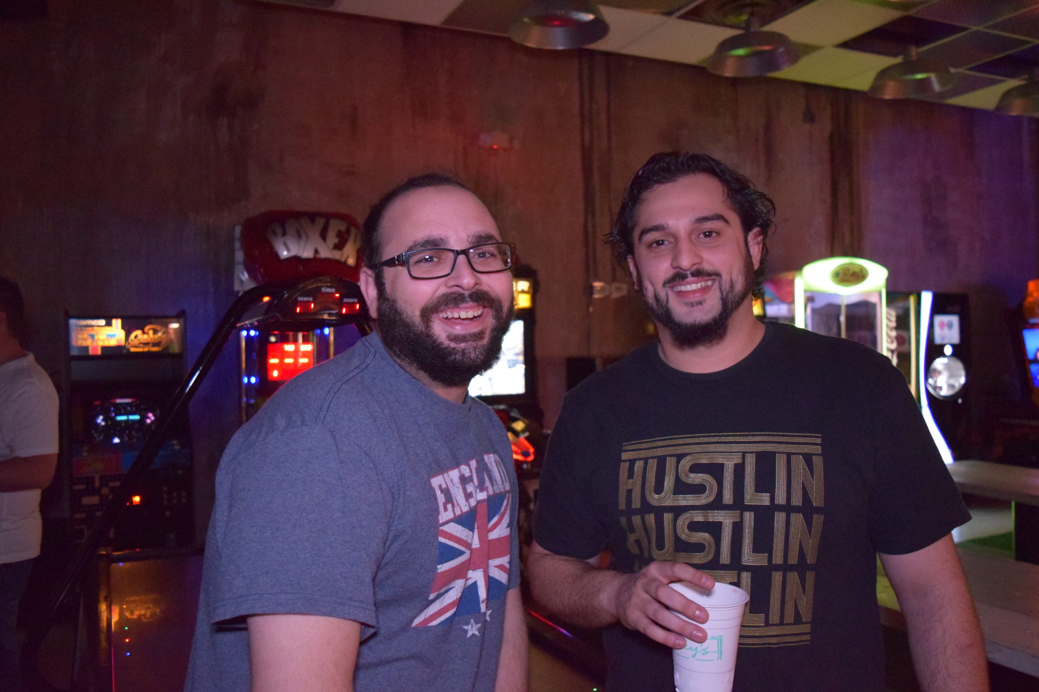 Comedians share a smile by the arcades